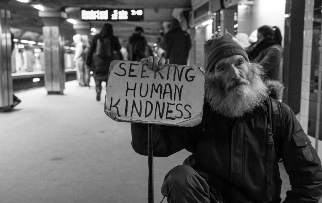 Homeless man with a sign